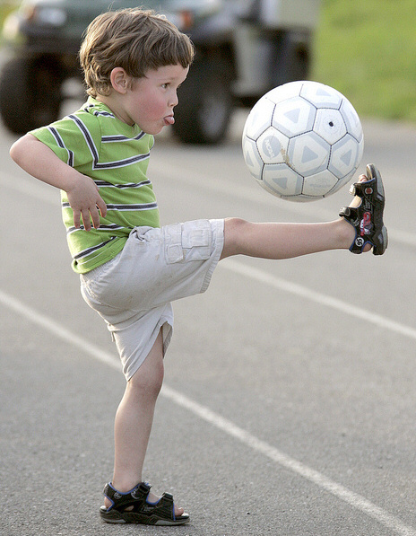 A Kid Playing Football