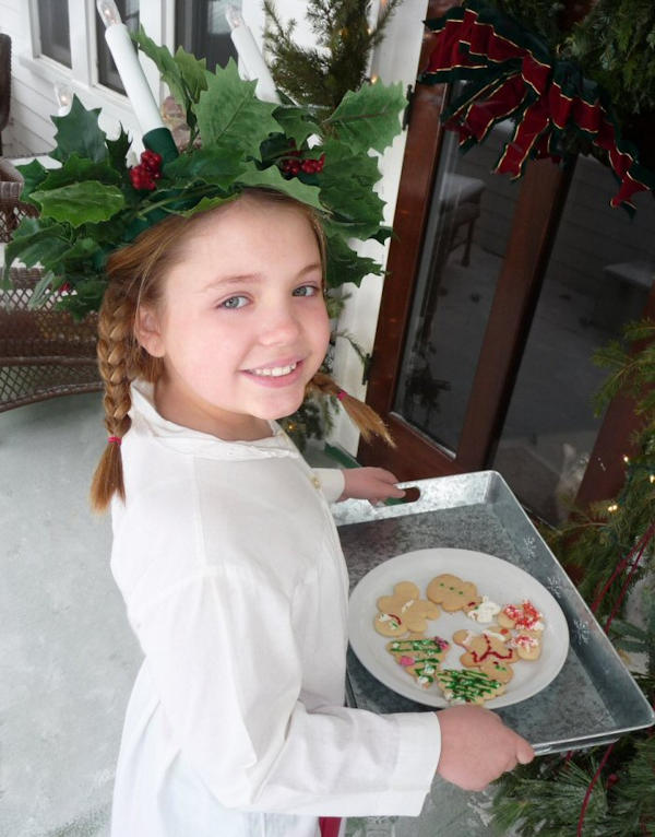 A girl dressed in a traditional Lucia Day costume